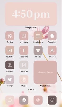 the pink and gray clock is displayed on the phone's screen, with flowers in the background