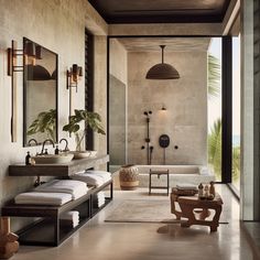 a large bathroom with two sinks, mirrors and a bathtub in the middle of it