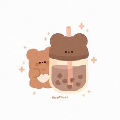 two brown teddy bears sitting next to a cup with liquid in it and stars on the side