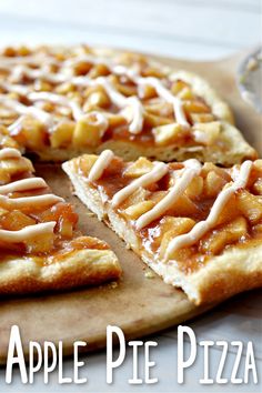 an apple pie pizza is cut into slices and sits on a cutting board with the words, apple pie pizza