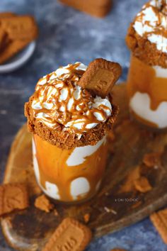 two dessert cups with marshmallows and graham crackers