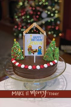 there is a cake that has been decorated with christmas trees and a happy birthday sign on it