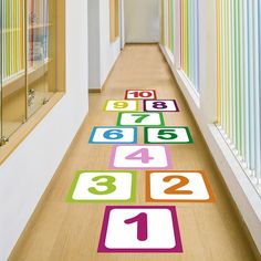 the hallway is lined with colorful numbers on the floor