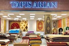 a carpet store with carpets and rugs on display