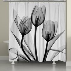 a black and white photo of flowers on a shower curtain