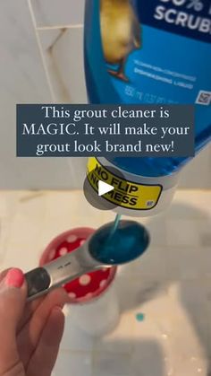 a person holding a pair of scissors in front of a sink with the caption, this grout cleaner is magic it will make your grout look brand new