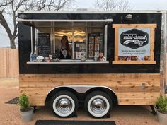 a food truck parked on the side of a road