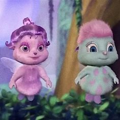 two cartoon characters standing next to each other in front of some trees and bushes, one with pink hair