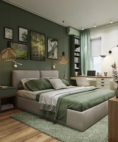 a bedroom with green walls and pictures on the wall above the bed, along with an area rug