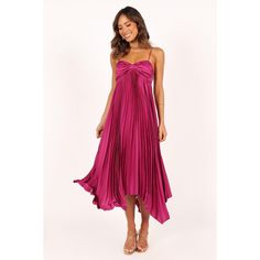 The Vikki Dress flatters any figure with its midi length, sweetheart neckline and asymmetrical hemline. Thin adjustable straps ensure the dress fits perfectly and is sure to turn heads. The back panel is shirred to ensure a comfortable fit and the fine pleats feature adds interest. The soft metallic satin feel of the dress lends it a luxe finish, while also being lightweight and comfortable. It's partially lined so you can be sure of all day comfort. If you are in between sizes, we suggest selec