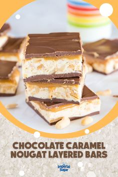 chocolate caramel nougat layered bars are stacked on top of each other