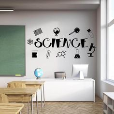 a classroom with black and white wall decals on the walls, including science symbols