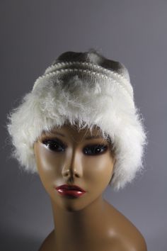 "This hand knit hat is knit with two yarns. A faux fur in white and a blended yarn of 65% wool and 35% alpaca in white. It is of medium weight, approximately 8 1/2\" in length. This fun looking knit hat with white faux fur trim is fun and sassy! Wear it with style for the winter! CARE INSTRUCTIONS Dry Clean Only" Knitted Alpaca Hats, White Warm Bonnet One Size, Warm White Bonnet One Size, Warm White Wool Hat, White Knit Winter Hat, White Crochet Knit Hat For Winter, Winter White Knit Hat, White One-size Bonnet For Cold Weather, White One Size Bonnet For Cold Weather