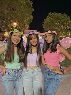 three young women standing next to each other