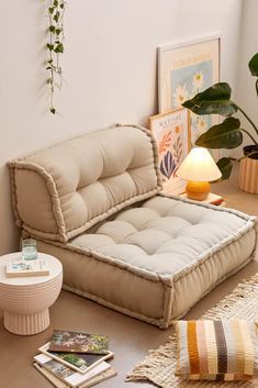 a living room filled with furniture and plants