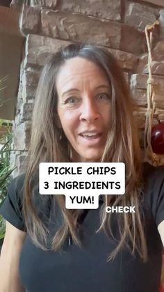 a woman with long hair holding up a sign that says pickle chips 3 ingredients yum