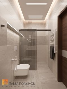 a bathroom with a toilet, sink and shower in it's center wall is illuminated by recessed lighting