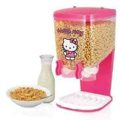 the hello kitty cereal dispenser is next to a bowl of cereal