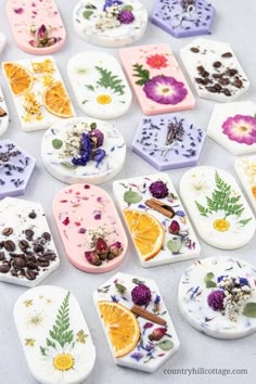 many different types of soaps with flowers and leaves on them, arranged in the shape of hexagons