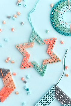 some type of beaded decoration on a table with sprinkles and beads