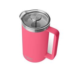 a pink coffee mug with a lid and handle