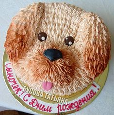 a birthday cake with a dog's face on it