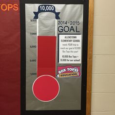 a bulletin board with an image of a school's goal