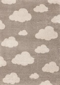 a pink rug with white clouds on it