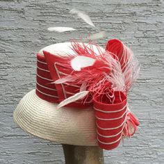 elegant derby wide brim hat made from high quality ivory parasisal with an astonishing coral and ivory decoration and coral feathers. Inspired from Audrey Hepburn style, its wide brim make it really special and suits almost all face types. The hat is hand blocked on a wooden block and hand stitched to perfection at Irina Sardareva millinery atelier. It is great to wear on Derby races, Royal Ascot ,Cocktail parties, Weddings, Tea parties, etc.  This hat is in size 22 1/4 (57 cm) . It can ... White Flat Brim Panama Hat For Kentucky Derby, Formal White Straw Hat With Short Brim, Formal White Sun Hat With Short Brim, White Panama Hat For Kentucky Derby Formal, White Panama Hat For Kentucky Derby, Summer High Crown Boater Hat For Races, White Formal Hat Band For Spring, Formal White Straw Hat With Curved Brim, White Panama Hat For Spring Formal Events