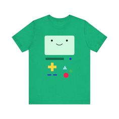 a green t - shirt with a smiling face on the chest and buttons around it