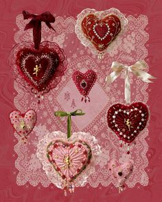 many different heart shaped ornaments on a pink background