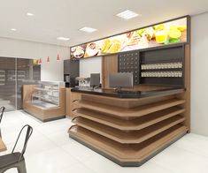 the interior of a fast food restaurant with lots of counter space and chairs around it