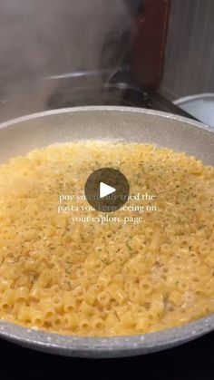 macaroni and cheese being cooked in a pan