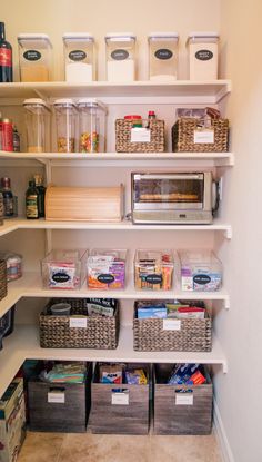 an organized pantry with bins and baskets