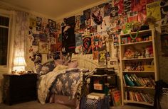 a bed room with a neatly made bed and lots of posters on the wall