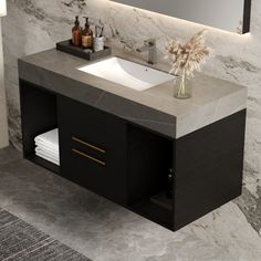 a bathroom vanity with marble counter top and mirror above it, next to a rug on the floor