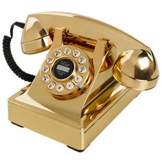 an old - fashioned golden telephone is shown on a white background