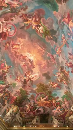 an ornate painting on the ceiling of a building