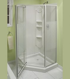 a bathroom with green walls and white tile on the floor is shown in this image