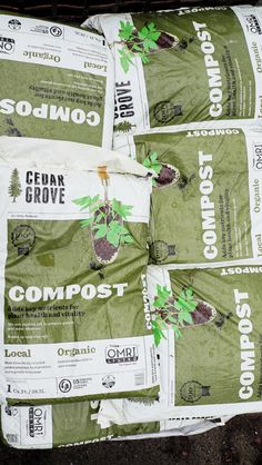 several bags of compost sitting on the ground