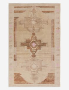 an old rug with geometric designs on the front and back side, in beige tones