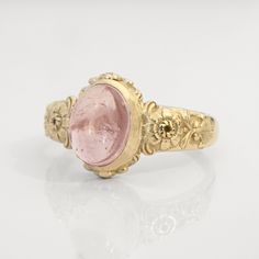 This vintage style peony-themed signet ring, featuring beautiful little peony flowers and leaves with fluorishes all around the center which displays a lovely pink tourmaline cabochon.  This ring can be customized with any letter or word (provided it fits) and is made in solid gold. This ring can be made for men or women and in your preferred size or color of gold. A phrase or letter may be written on the inside, too! Measurements: 10 x 12mm Material: 8K or 14K solid gold (rose, white or yellow) Luxury Vintage Cameo Signet Ring, Vintage Flower Shaped Jewelry With Rose Cut Diamonds, Vintage Flower Ring With Gemstone, Vintage Flower Shaped Gemstone Ring, Vintage Gemstone Flower Promise Ring, Vintage Birth Flower Rings For Anniversary, Vintage Rose Design Flower Ring For Wedding, Vintage Rose Gold Flower Ring, Vintage Rose Design Rings For Wedding