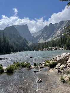 a mountain lake surrounded by trees and rocks