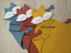 four different styles of baby blankets with the names sage brick, ocher and fox on them