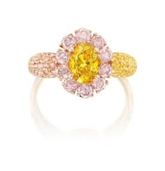 Featuring: One oval Fancy Intense Orange-Yellow diamond, 1.03 carats Surrounded by ten brilliant-cut pink diamonds, with smaller pink and yellow diamonds on shank 18 karat pink and yellow gold "An Exquisite Coloured Diamond Ring" Colored Diamond Rings, Pink Diamonds, Yellow Diamonds, Aesthetic Movement, Contemporary Modern Art, Pink And Yellow, Yellow Diamond, Pink Diamond, Antique Collection