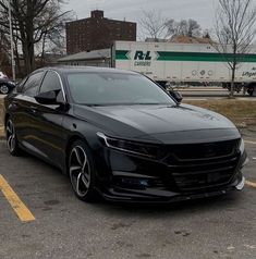 a black car parked in a parking lot