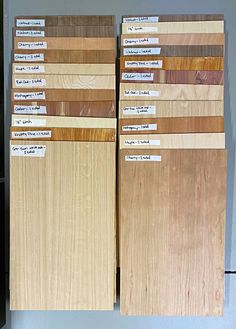 several different types of wood with labels on the doors and flooring boards in front of them