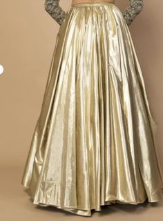 Glamorous Golden Metallic Skirt - Shimmering Elegance for Every Occasion Radiate sophistication and capture the spotlight with this stunning golden metallic skirt. Crafted to perfection, this skirt seamlessly blends contemporary style with a touch of vintage glamour. Description: Color: Luxurious Golden Metallic Material: High-quality Metallic Fabric Long Skirt in shimmer metallic fabric light soft smooth with crepe lining. Versatile Glam 🌟 Whether you're attending a glamorous evening event, a stylish cocktail party, or a special celebration, this skirt is the perfect choice. Pair it with your favorite heels and a sophisticated top to create an ensemble that's as unforgettable as you are. we offer colour customizations as per need and choice  for readymade sized please follow below chart Sequin Skirt For Wedding, Elegant Saree Skirt For Party, Festive Party Wear Skirt With Traditional Drape, Festive Resham Embroidery Skirt, Festive Traditional Drape Party Skirt, Wedding Skirt With Resham Embroidery, Festive Party Wear Long Skirt, Elegant Festive Lehenga With Flowy Skirt, Party Wear Long Skirt