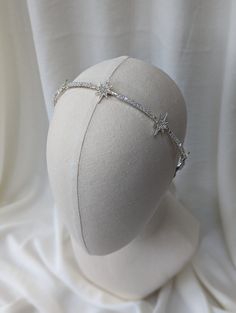 *STARLIGHT SILVER HEADBAND* A beautifully hand crafted, delicate headband with stunning crystal silver stars. 3 large stars and 2 smaller set at the ends.  All the stars are set apart with a row of square rhinestones that give off a subtle sparkle when the light hits.  DETAILS * Handcrafted together using tarnish free silver wire. Star details and square rhinestones. * Set onto a comfortable, sturdy but flexible Headband. Ribbon wrapped and padded at each end to create the perfect fit. If you fe Celestial Headband, Headband Ribbon, Wire Star, Delicate Clothes, Silver Headband, Crown Bridal, Set Apart, Ribbon Wrap, Crystal Headband