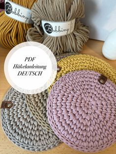 four crocheted round placemats on a table with text overlay that says pdf hakendenheing deutsch